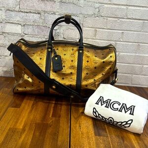 MCM Metallic Visetos Traveler Weekender Duffle
Bag in Gold
